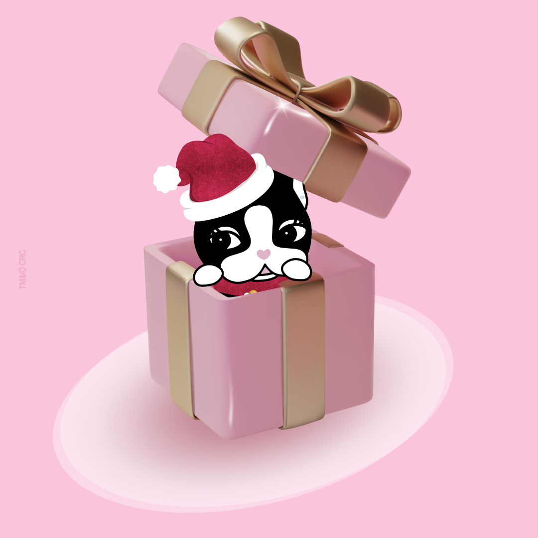 Rebecca Bonbon com toca de natal saindo de uma caixa de presente